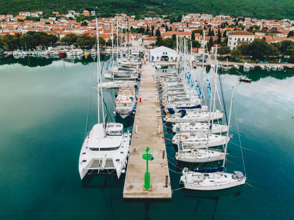 Regatta yachts berthed together on the pontoon at Marina Punat during Alpe Adria Sailing Week