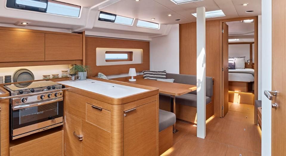 Saloon and galley of the Bénéteau FIRST 44 with light wood