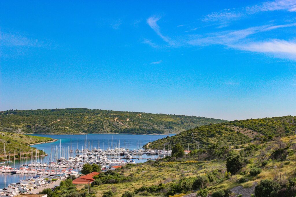 View over Marina Kremik near Primošten with sailing yachts in the sheltered bay