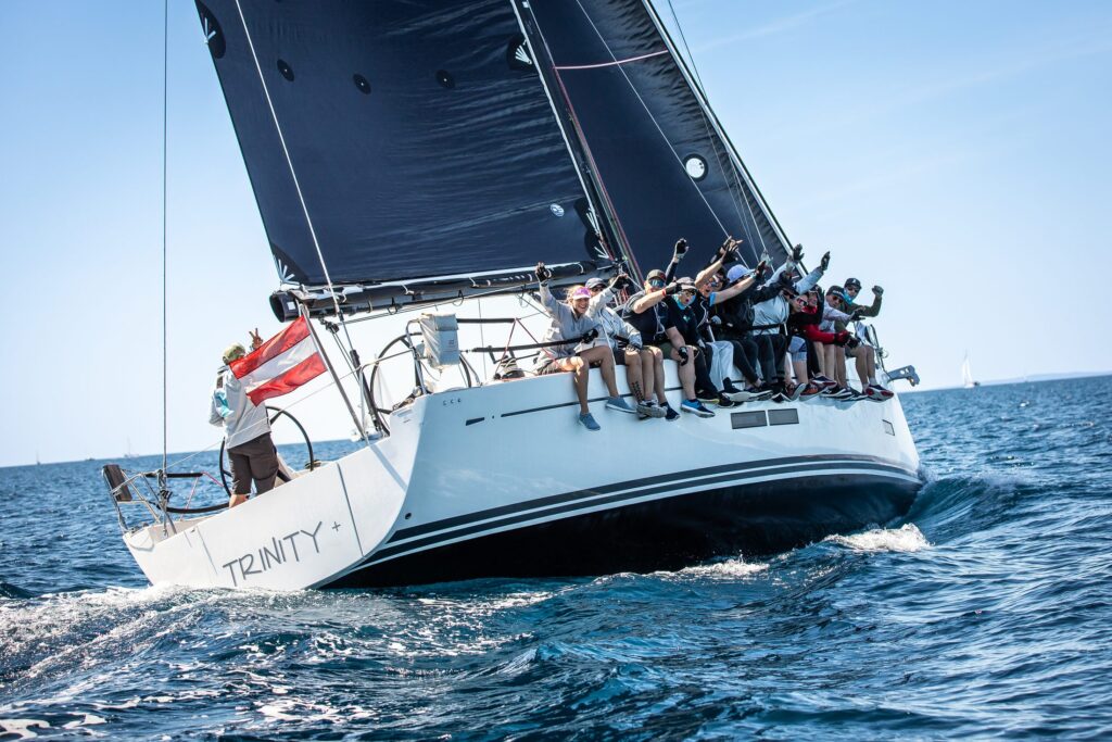Crew on the performance yacht TRINITY+ during a regatta in Croatia