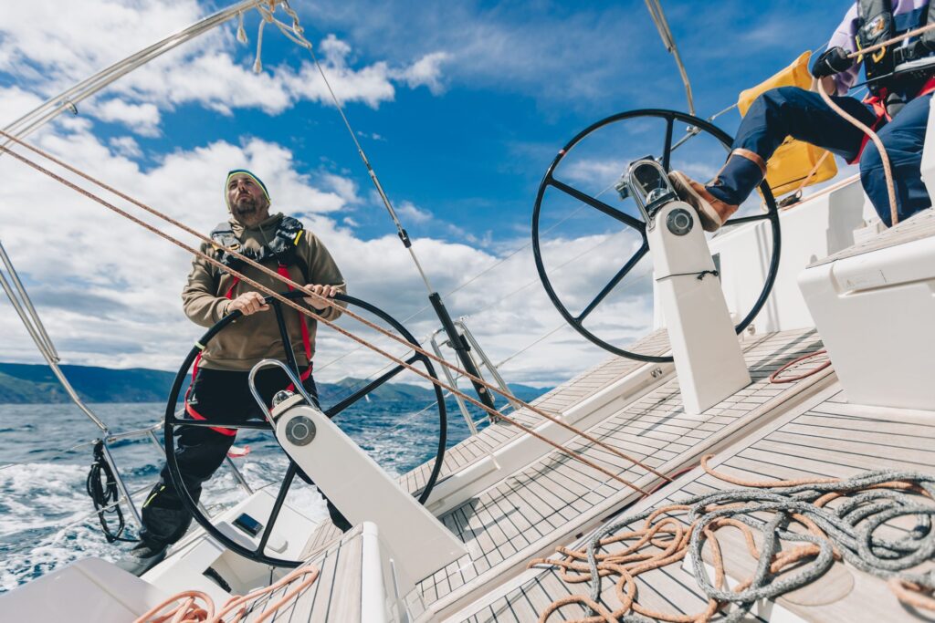 Helmsman at one of the two steering wheels of the Solaris 44.1 TRINITY+